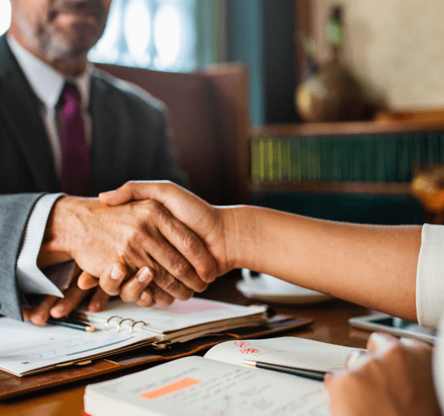 Business people shake hands before meeting